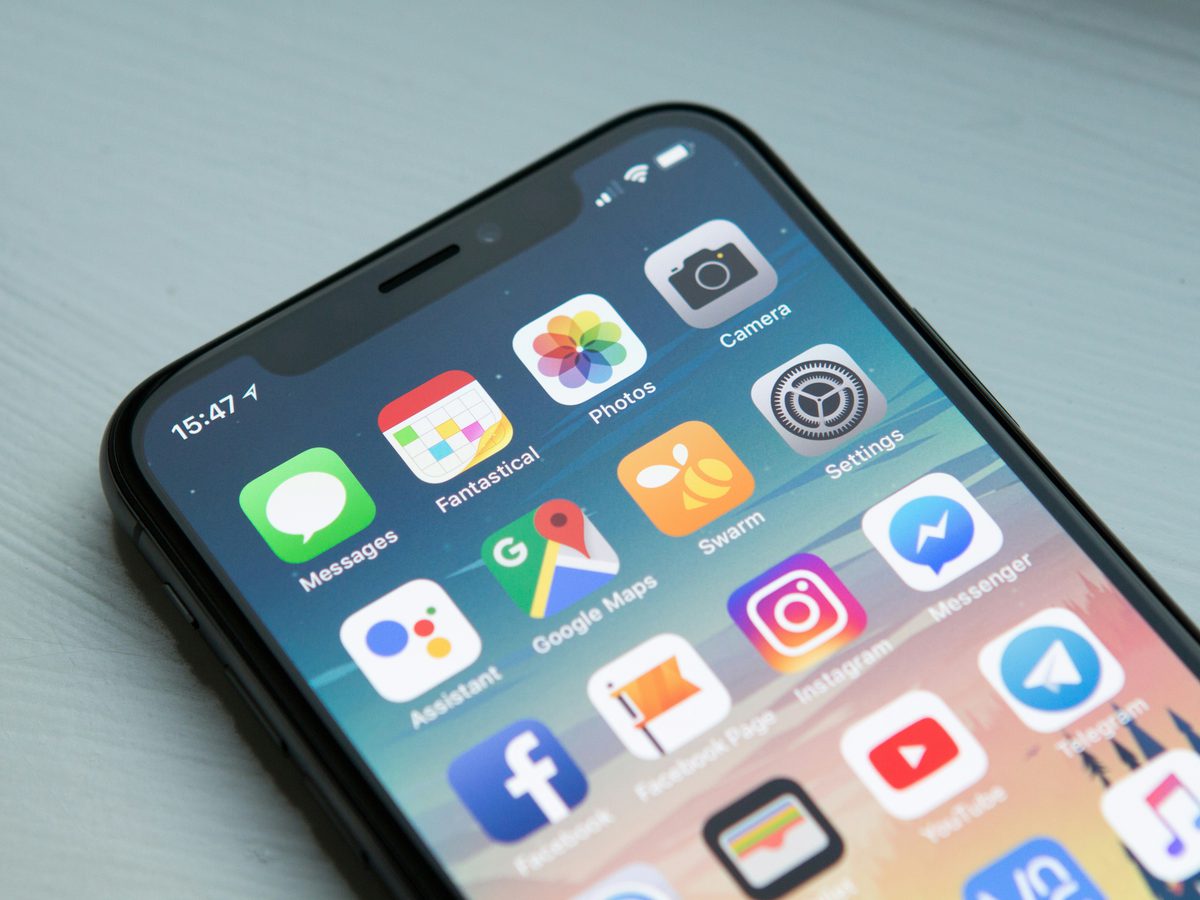 A phone home screen full of social and marketing apps